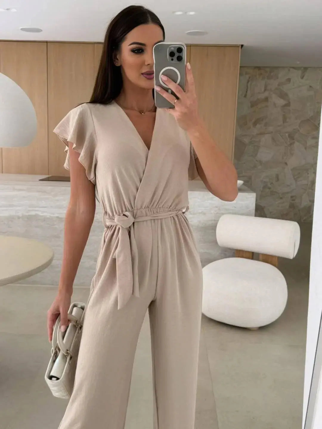 MEWE | Sleeveless V-Neck Jumpsuit with Belt and Wide-Leg Design Mewe London
