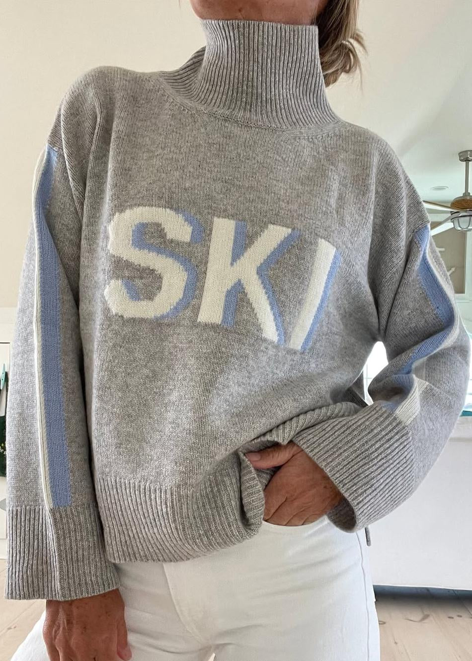 MEWE | Oversized Turtleneck Ski Jumper with Intarsia Graphic and Stripe Sleeves Mewe London